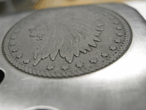 Deep engraving gun steel close up